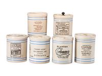 Six Stoneware Advertising Crocks