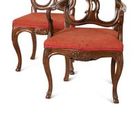 A Suite of Fourteen Italian Baroque Style Walnut Dining Chairs — 19th Century