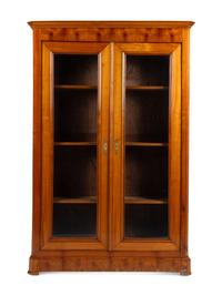 A Biedermeier Figured Walnut Two-Door Bookcase