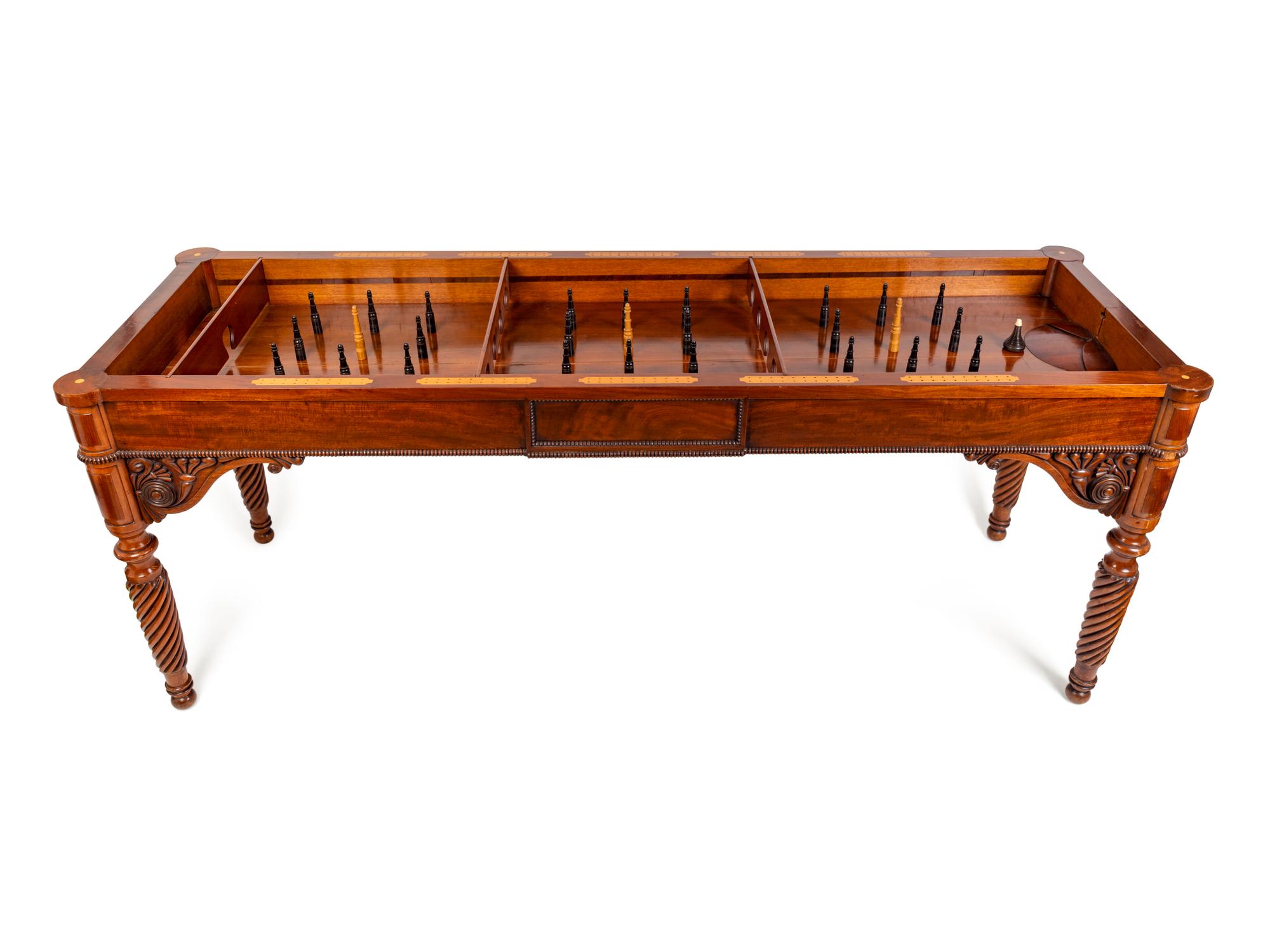 An Edwardian Carved Mahogany Ninepins Table — CIRCA 1900
