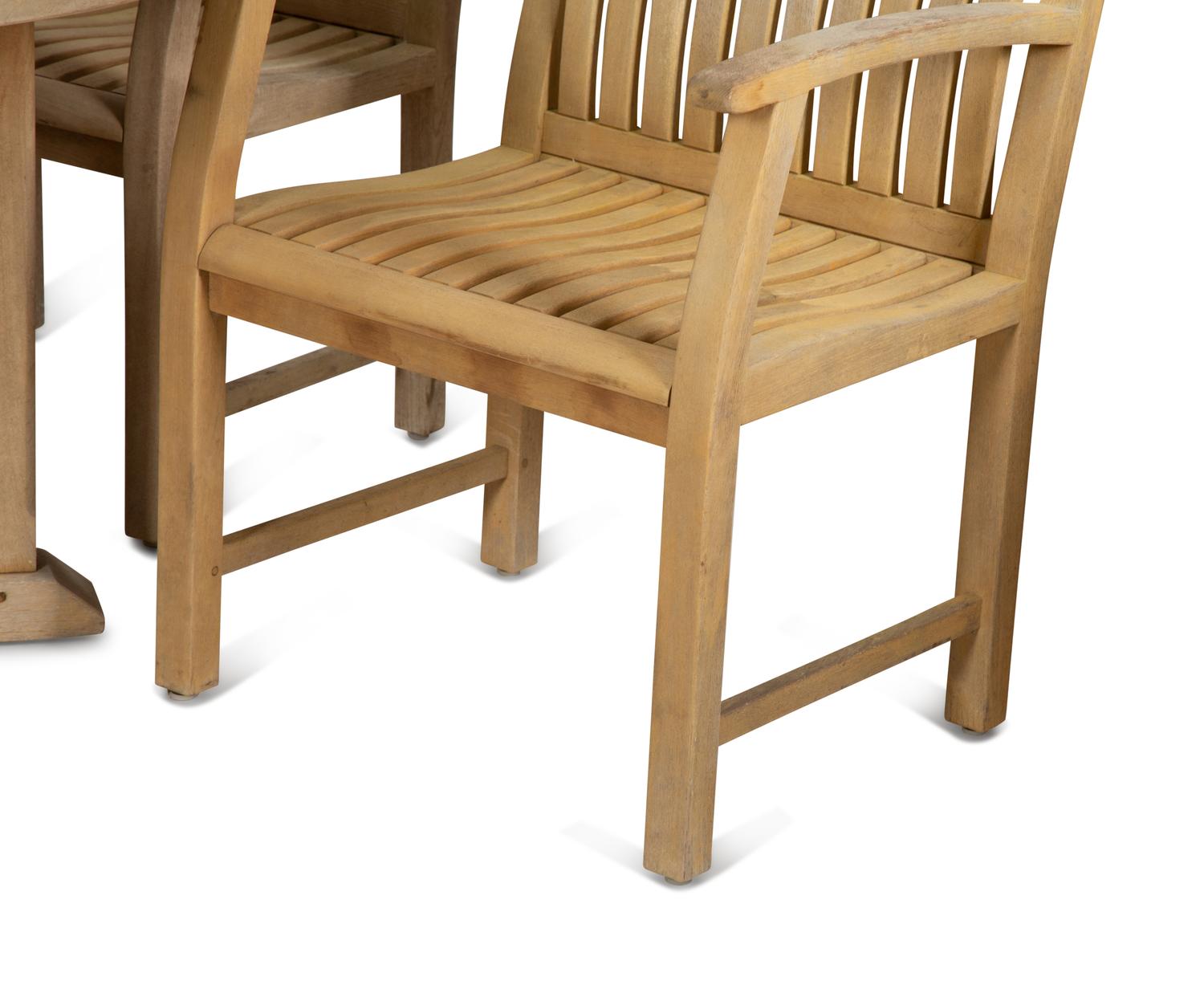 A Contemporary Teak Outdoor Dining Table and Four Chairs
