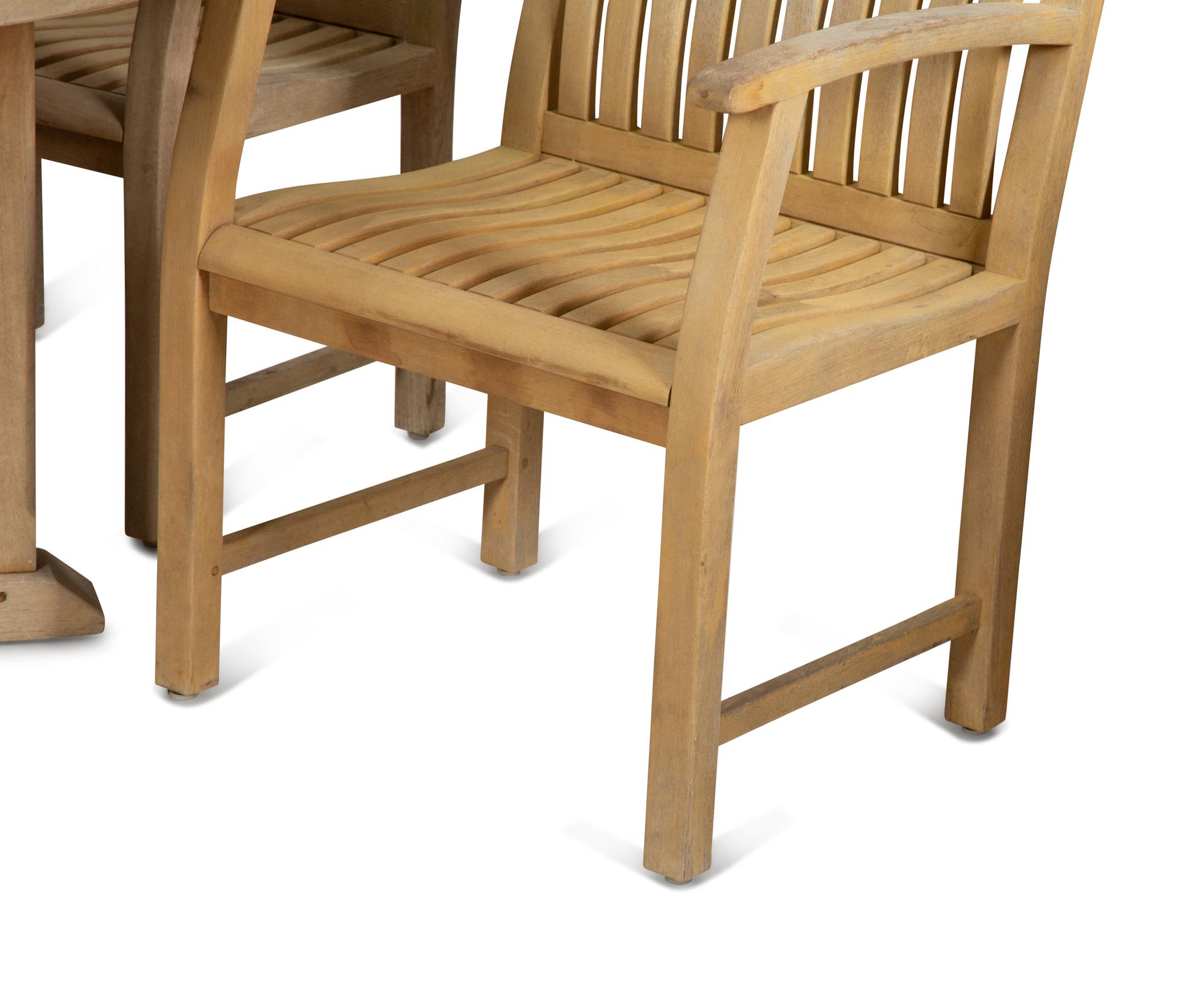 A Contemporary Teak Outdoor Dining Table and Four Chairs
