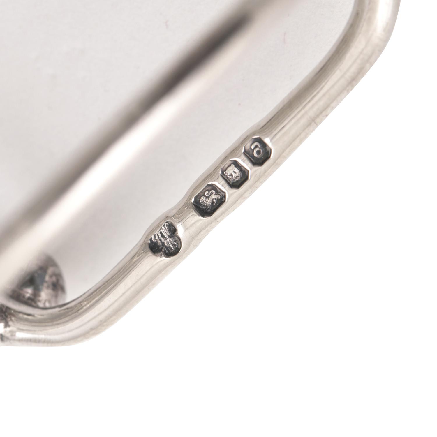 A Set of Four English Silver Trefoil Salt Cellars and a Silver Toast Rack