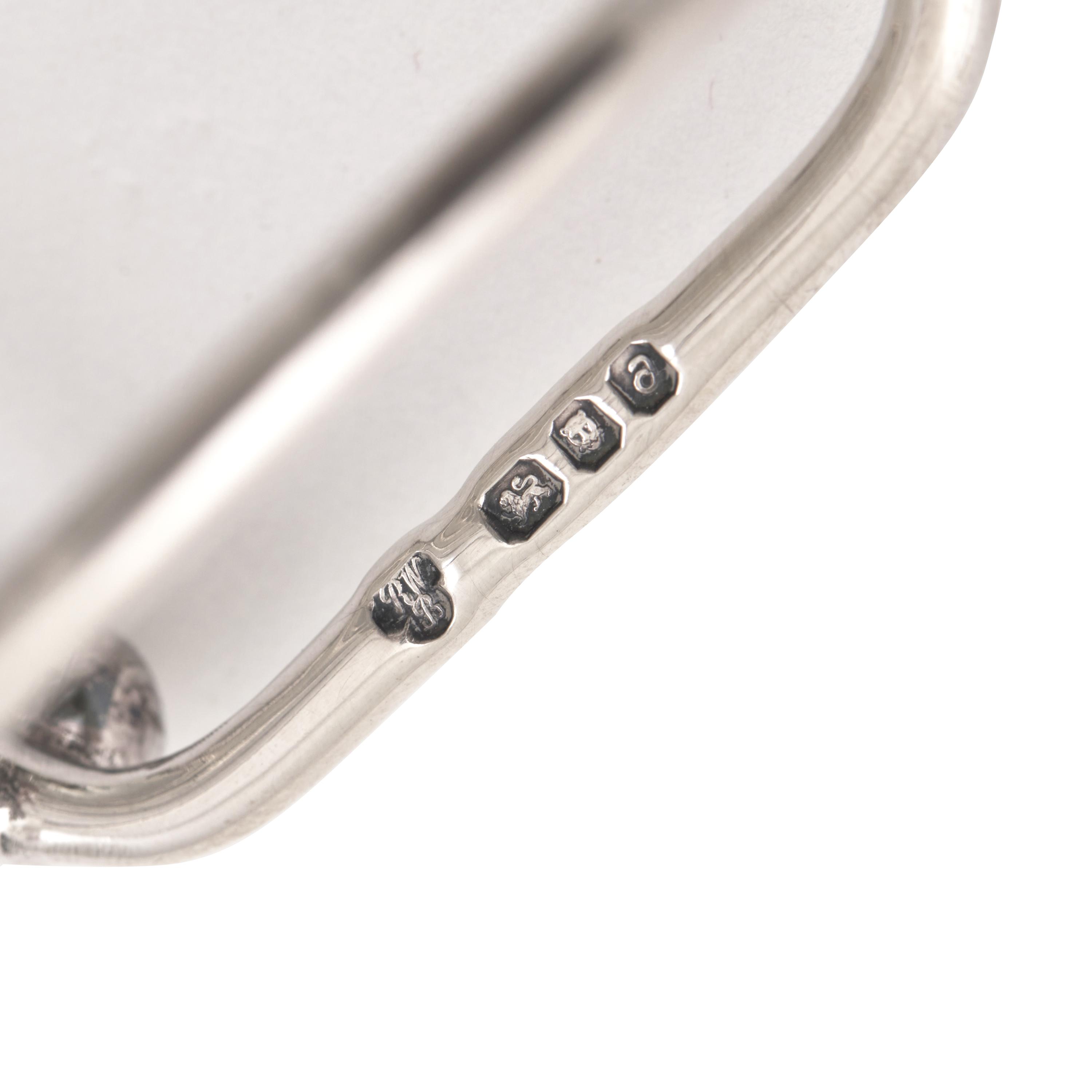 A Set of Four English Silver Trefoil Salt Cellars and a Silver Toast Rack