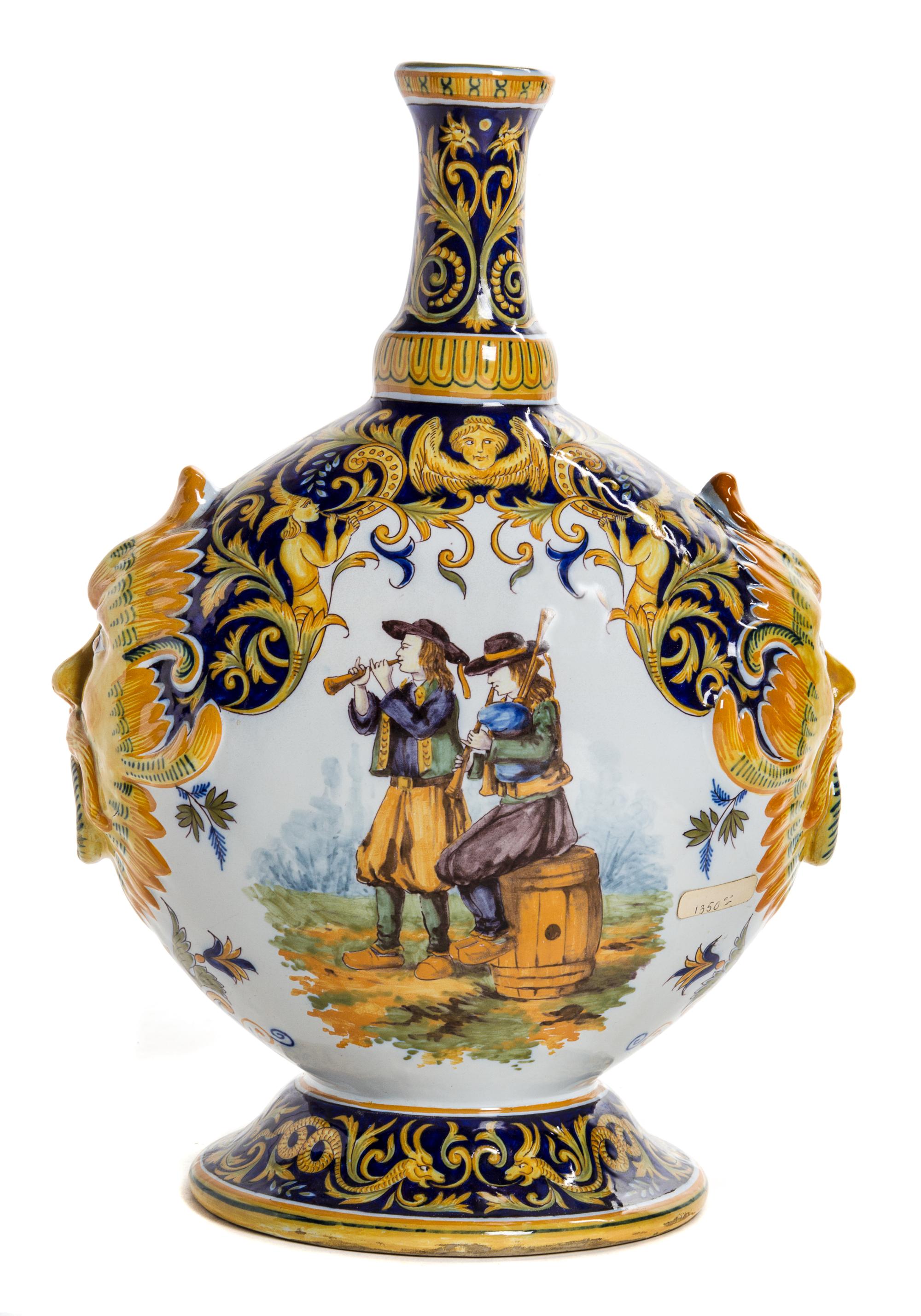 A Quimper Pottery Vase Height 14 1/2 inches.