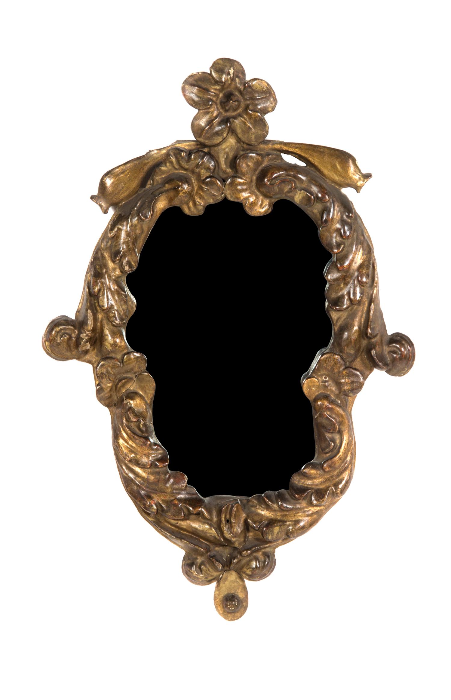 An Italian Rococo Giltwood Mirror, Height 25 x width 16 1/2 inches.