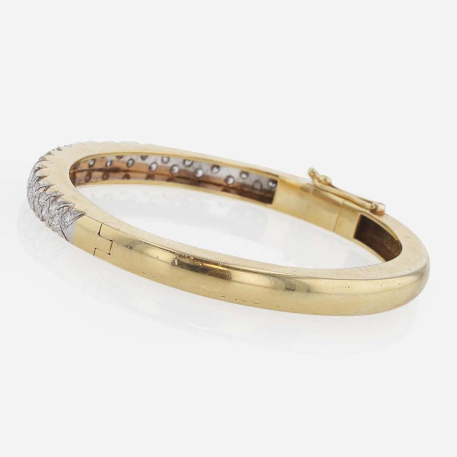 An 18K Gold and Diamond Bangle Bracelet by Carl D. Lindstrom & Sons