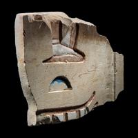 An Egyptian Painted Limestone Relief Fragment