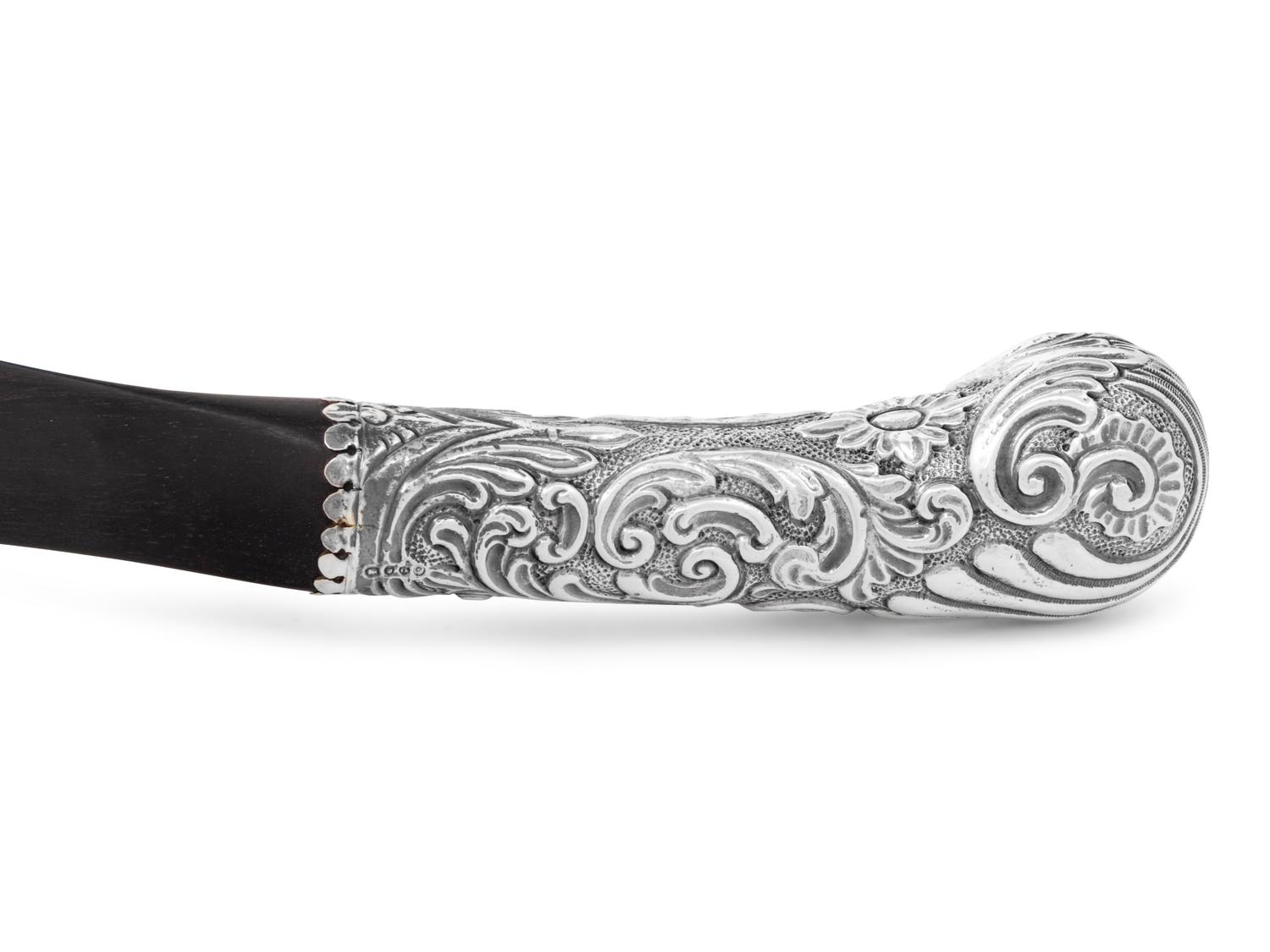 A Victorian Silver and Ebony Scimitar-Form Page Turner