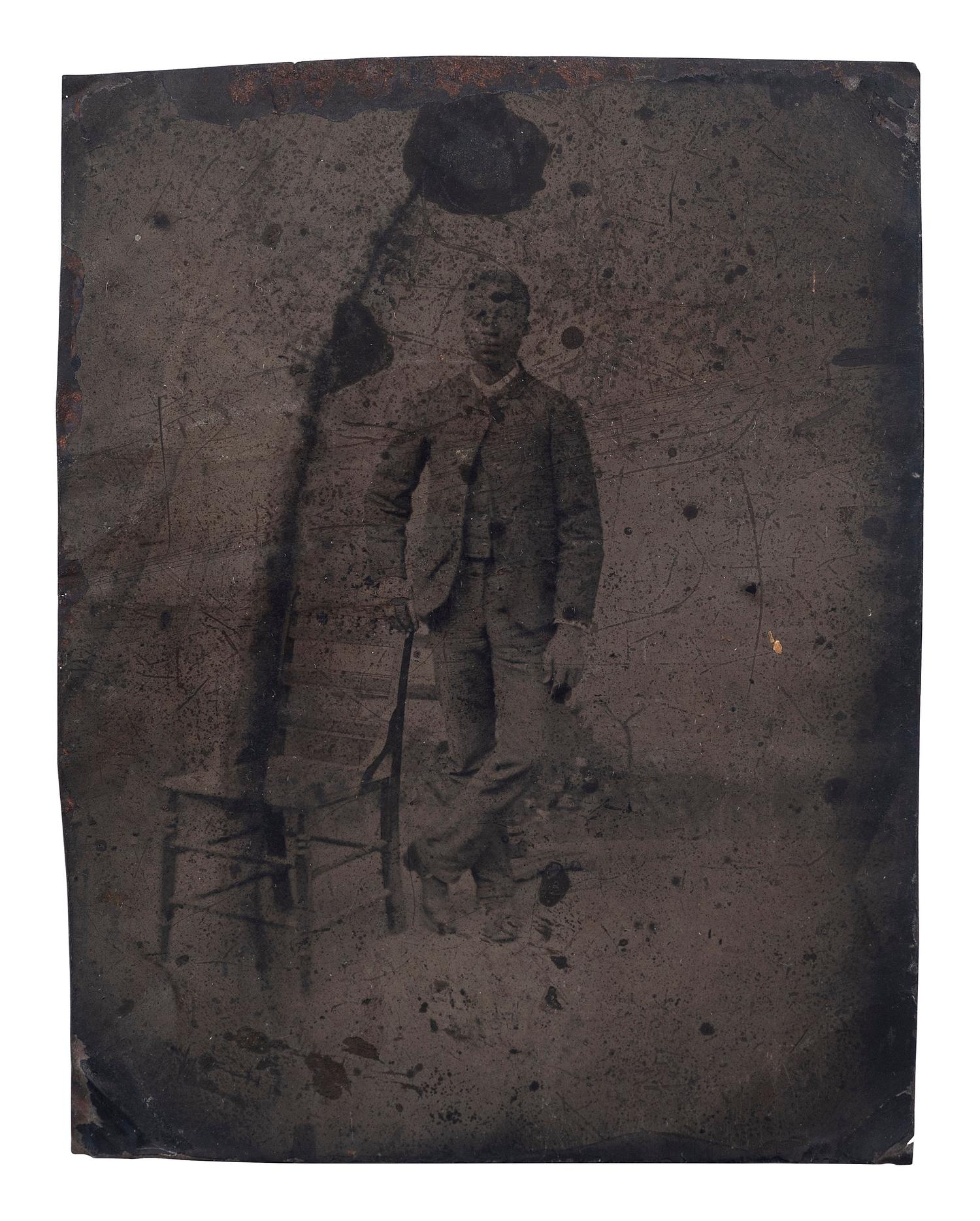 [AFRICAN AMERICANA] -- [EARLY PHOTOGRAPHY]. A group of 3 photographs of African American subjects, incl. tintypes and brooch.