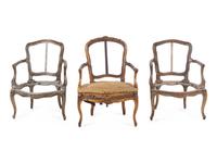 A Pair of Louis XV Fauteuils and an Associated Fauteuil