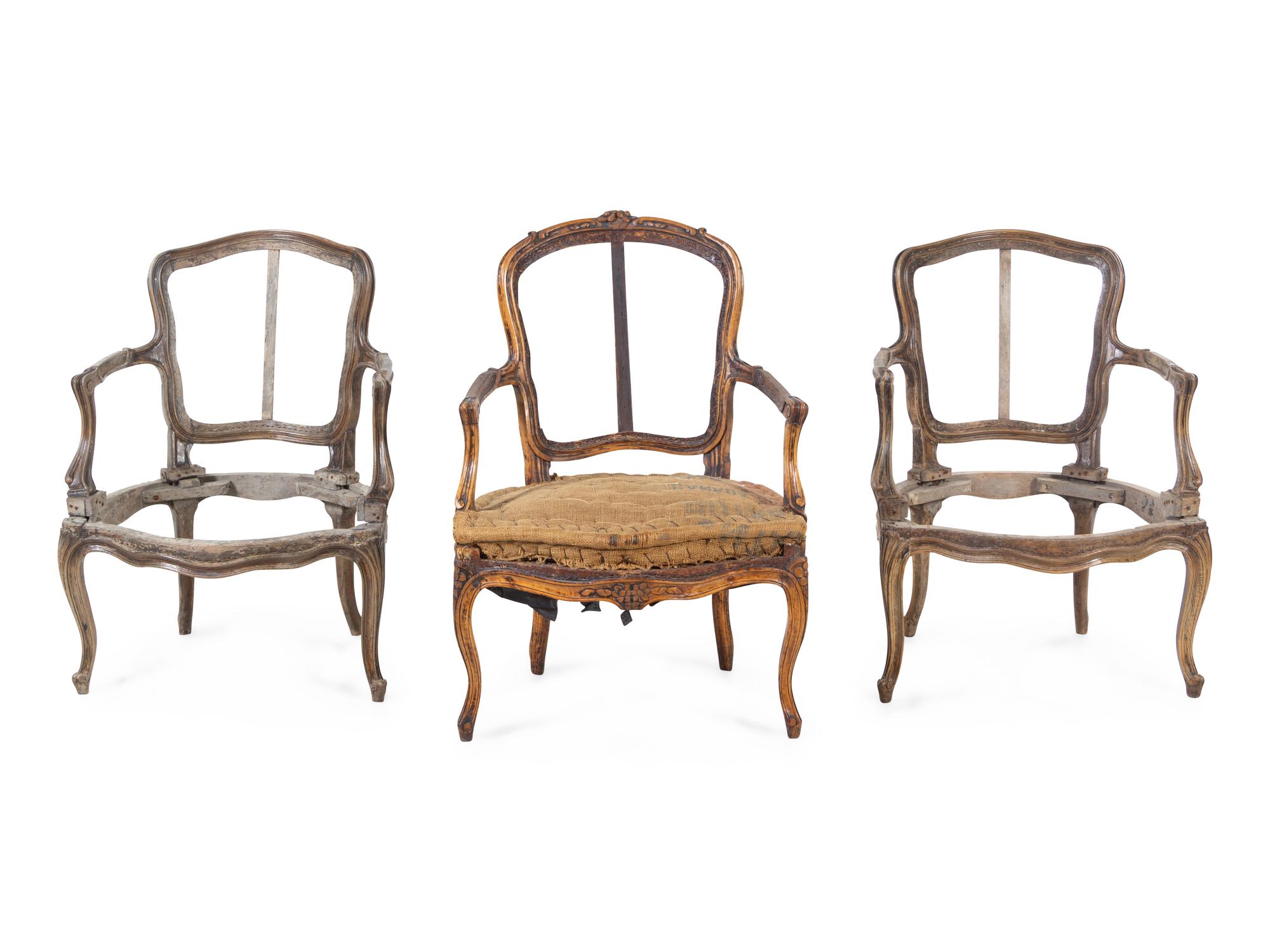 A Pair of Louis XV Fauteuils and an Associated Fauteuil