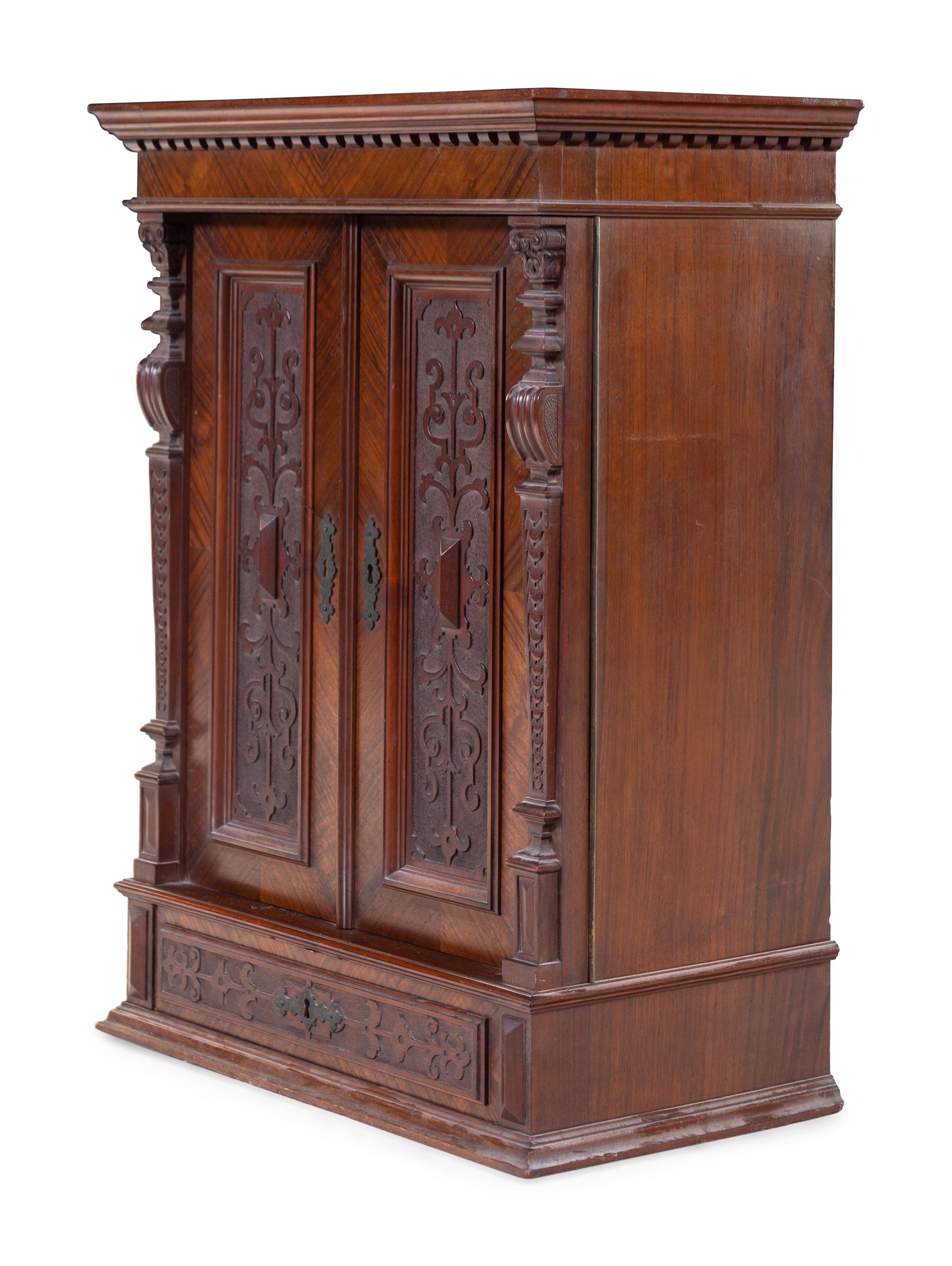 A Renaissance Revival Carved Walnut Side Cabinet