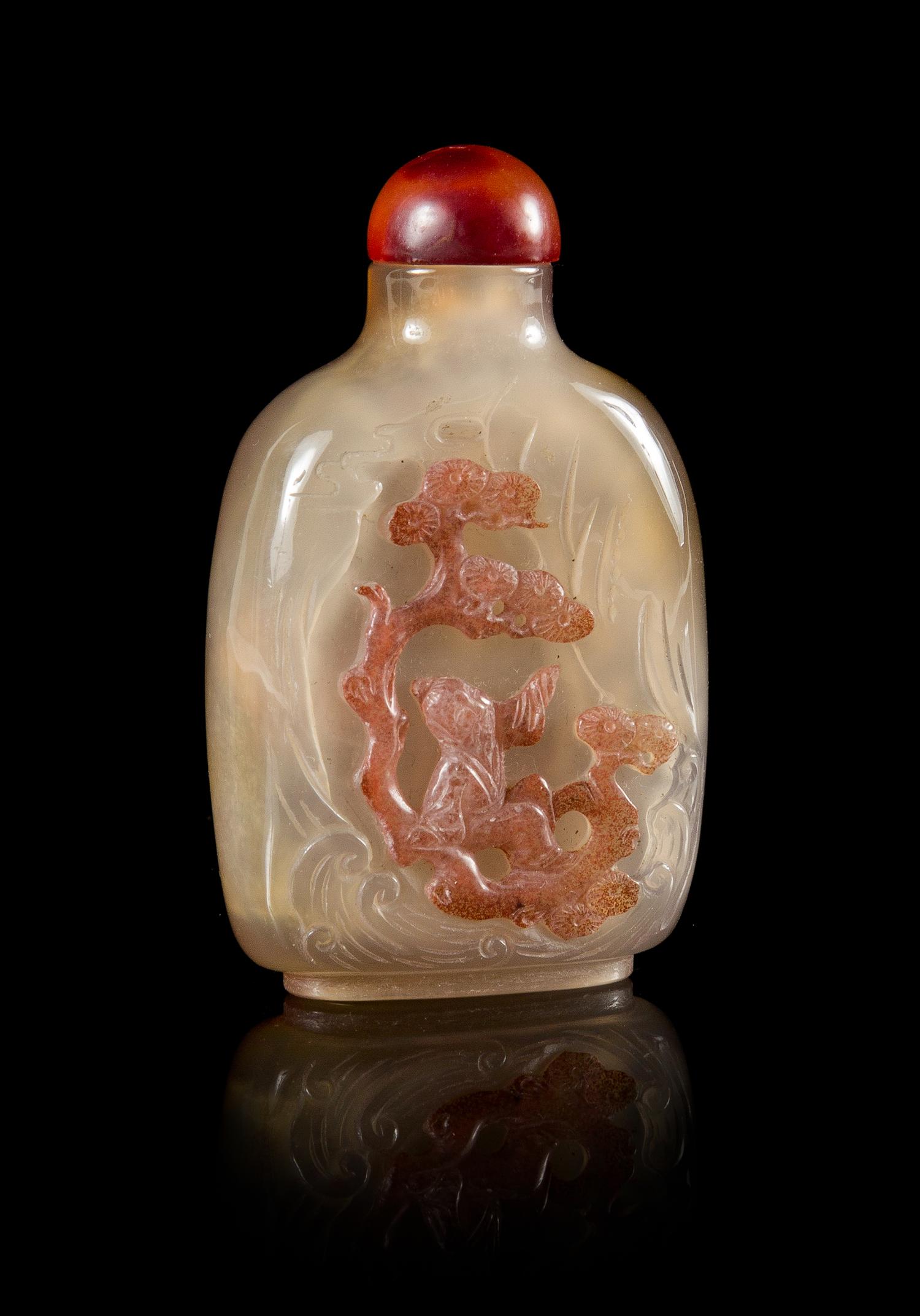 A Carved Agate Snuff Bottle Height 3 1/8 inches.