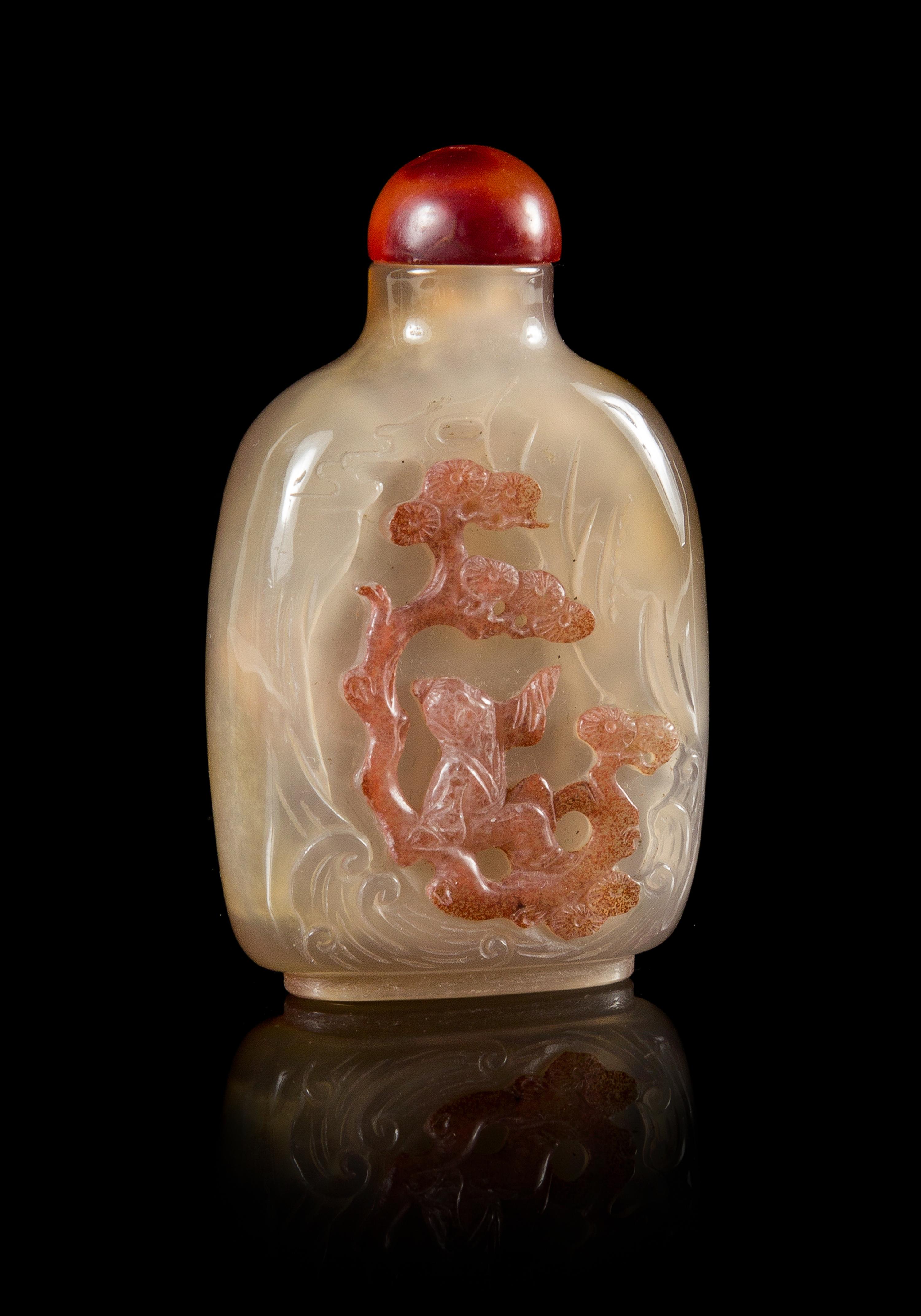 A Carved Agate Snuff Bottle Height 3 1/8 inches.