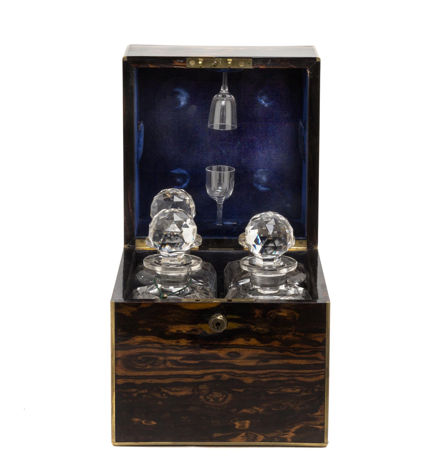 A Regency Calamander Cased Liquor Set, Height 10 1/4 x width 9 x depth 9 inches.