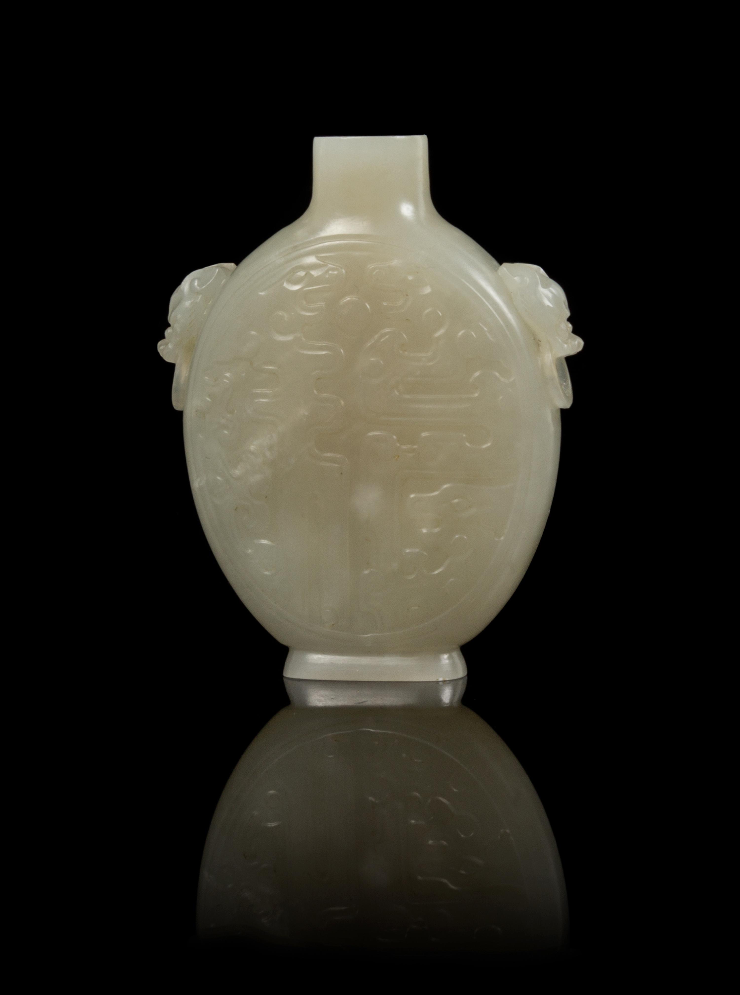 A Carved Jade Snuff Bottle Height 2 3/8 inches.