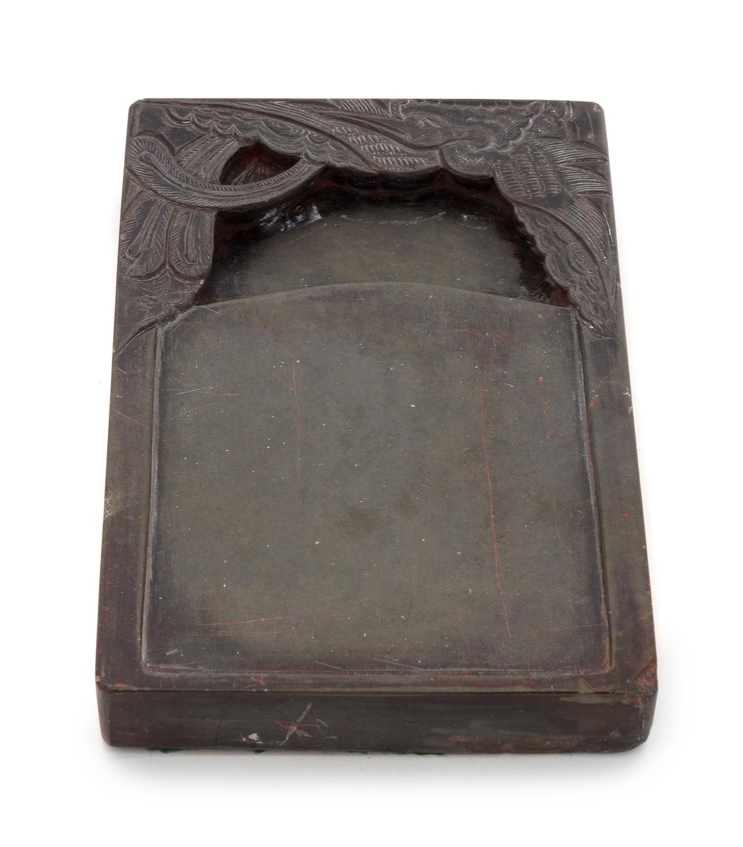 A Duan Inkstone Height 8 1/4 x width 5 1/2 x depth 1 1/4 inches.