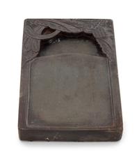 A Duan Inkstone Height 8 1/4 x width 5 1/2 x depth 1 1/4 inches.