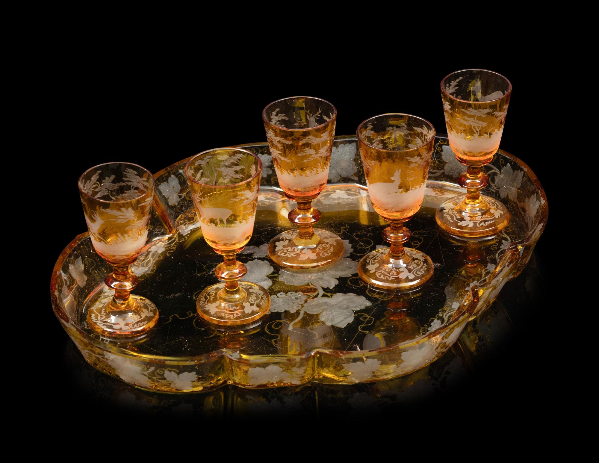 A Collection of Bohemian Amber Cut to Clear Glassware