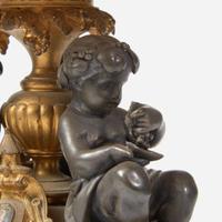 A pair of French Napoleon III patinated and gilt bronze tazza with fauns Bearing marks for Henri Picard (French, active 1831-1864), late 19th century