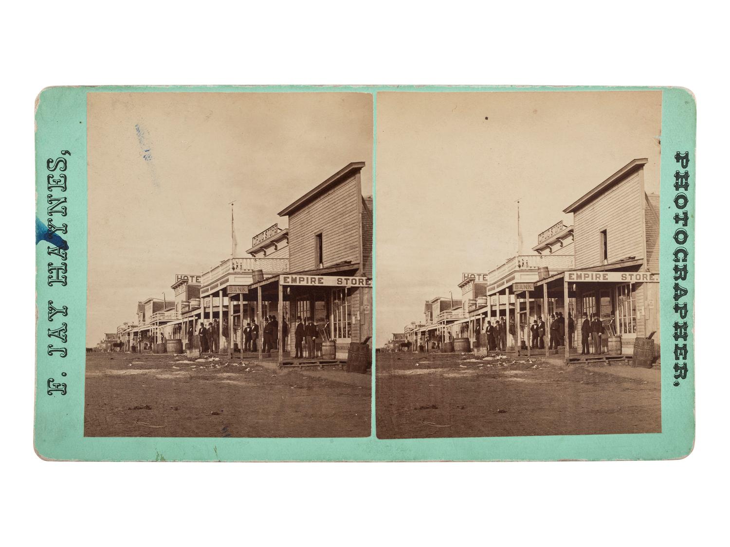 [WESTERN AMERICANA]. HAYNES, F.J., photographer. Stereview of Main Street, Bismarck, Dakota Territory.