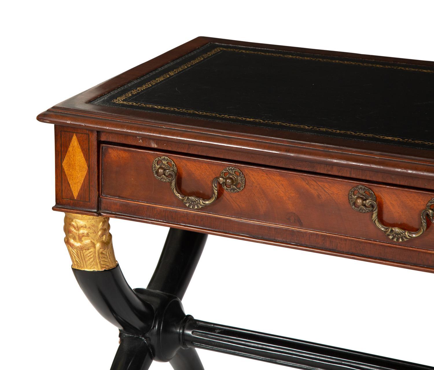 A Regency Style Parcel Gilt and Ebonized Mahogany Leather Top Console Table