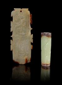Two Celadon and Russet Jade Pendants Length of largest 3 1/4 inches.