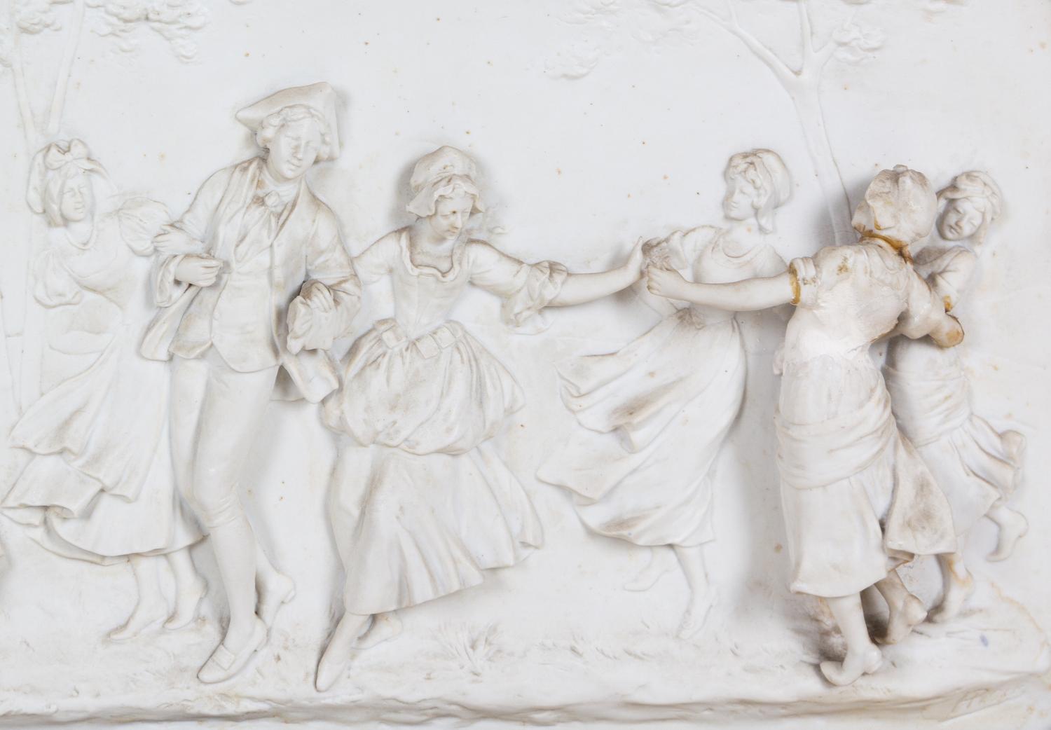A Painted and Parcel Gilt Mirror with an Inset Bisque Porcelain Plaque
