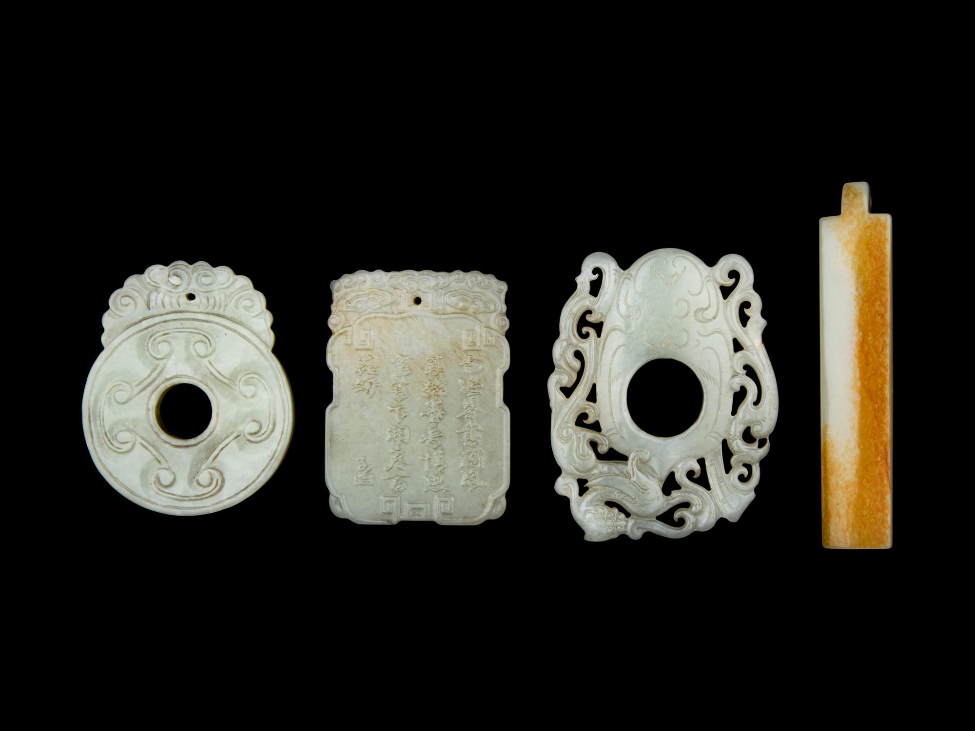 Four Chinese Carved Celadon Jade Pendants
