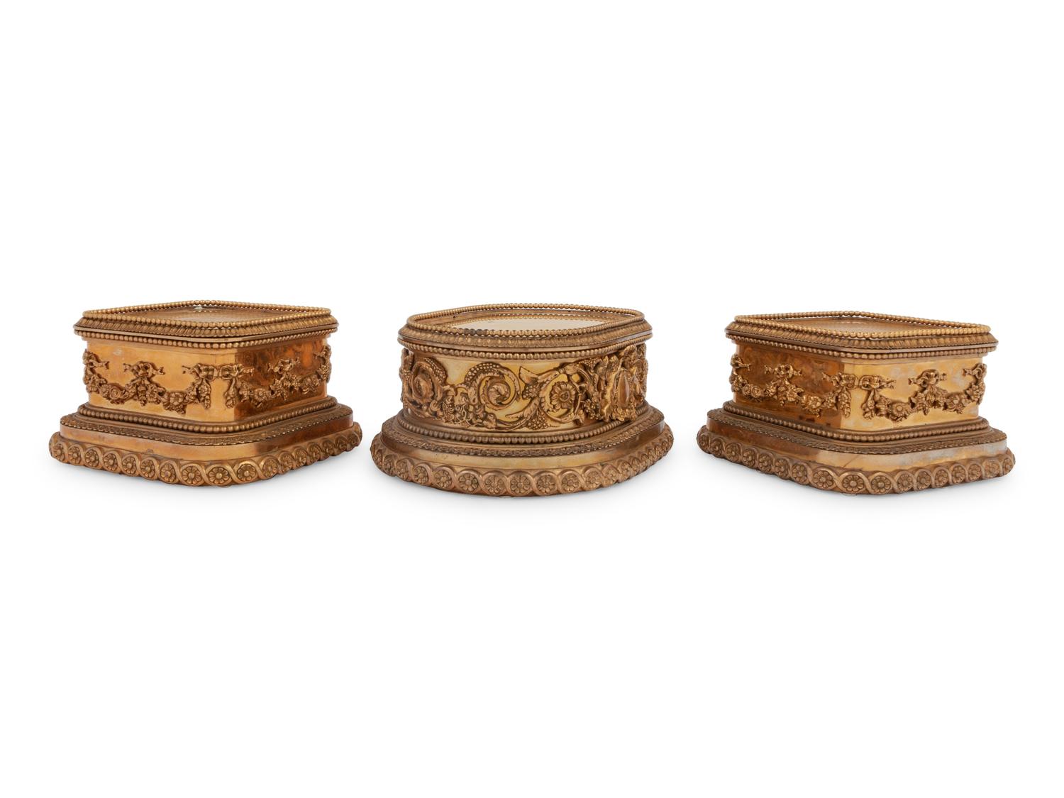 A Group of Three P.E. Guerin Gilt Bronze Garniture Stands