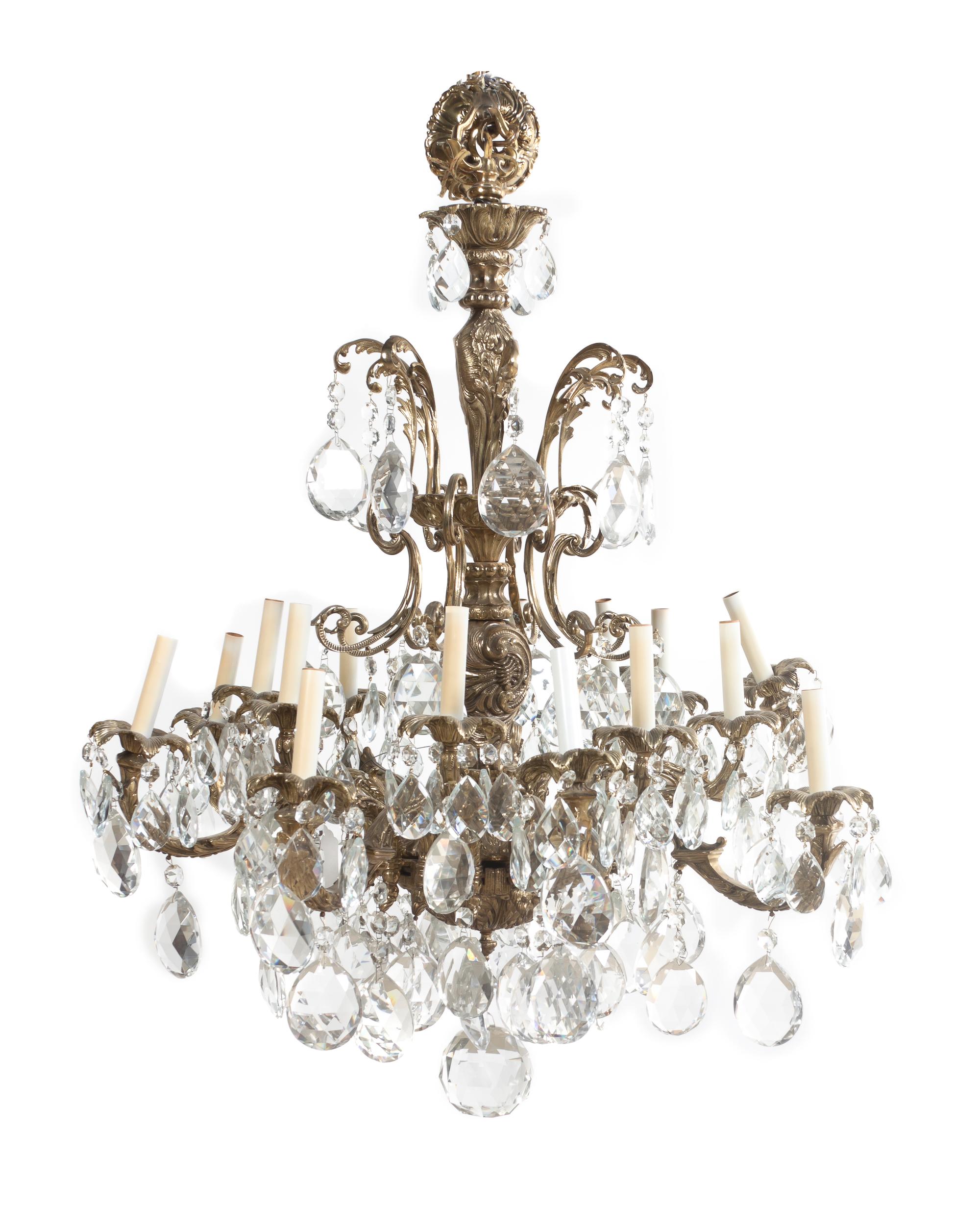 A Louis XV Style Gilt Bronze Sixteen-Light Chandelier, Height 37 inches x diameter 32 inches.