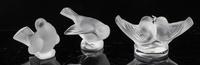 A Group of Three Lalique Frosted Glass Figures Height of tallest 3 1/8 inches.