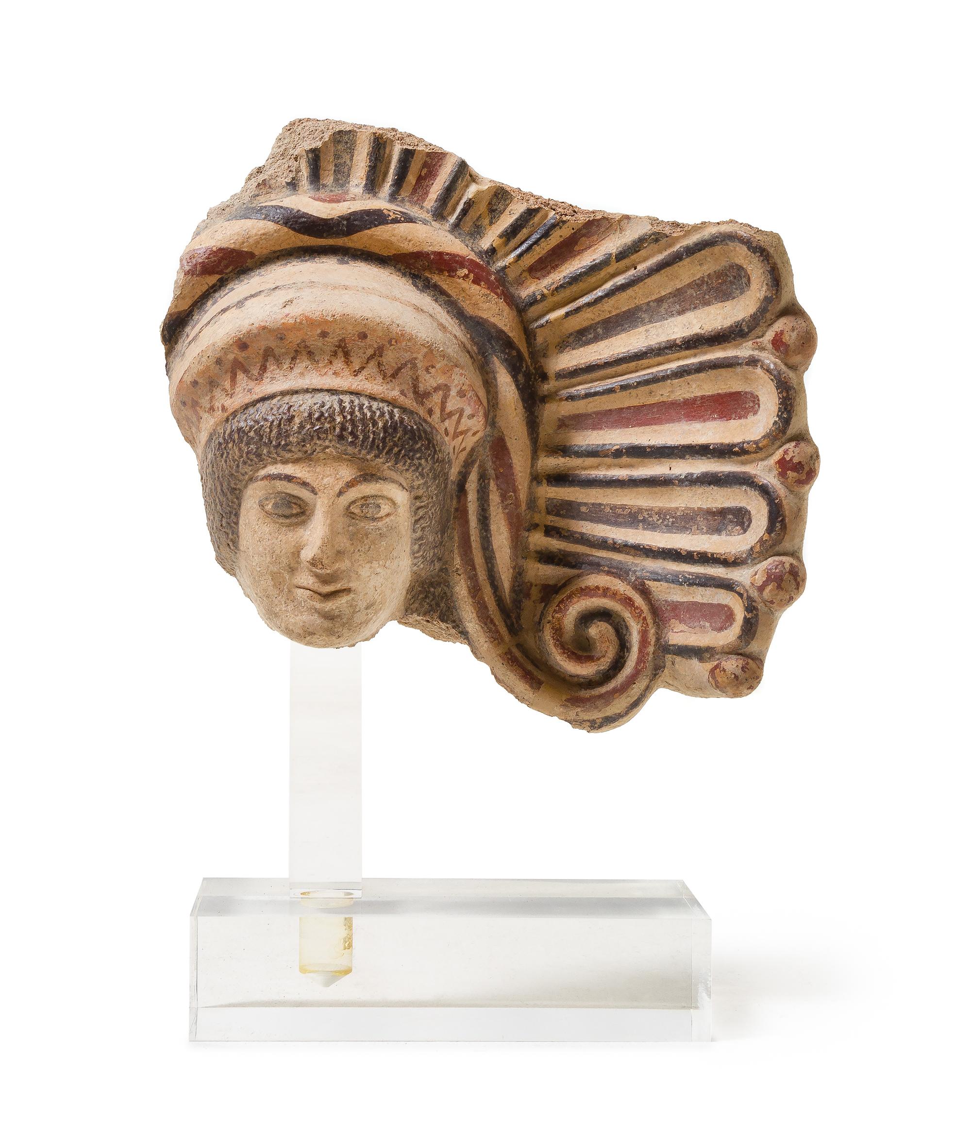 An Etruscan Terra Cotta Antefix Length 10 1/8 inches. — CIRCA EARLY 5TH CENTURY B.C.E.