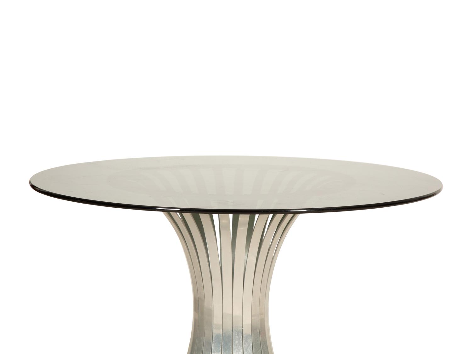 A Russell Woodard Dining Table with Four Chairs