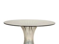 A Russell Woodard Dining Table with Four Chairs