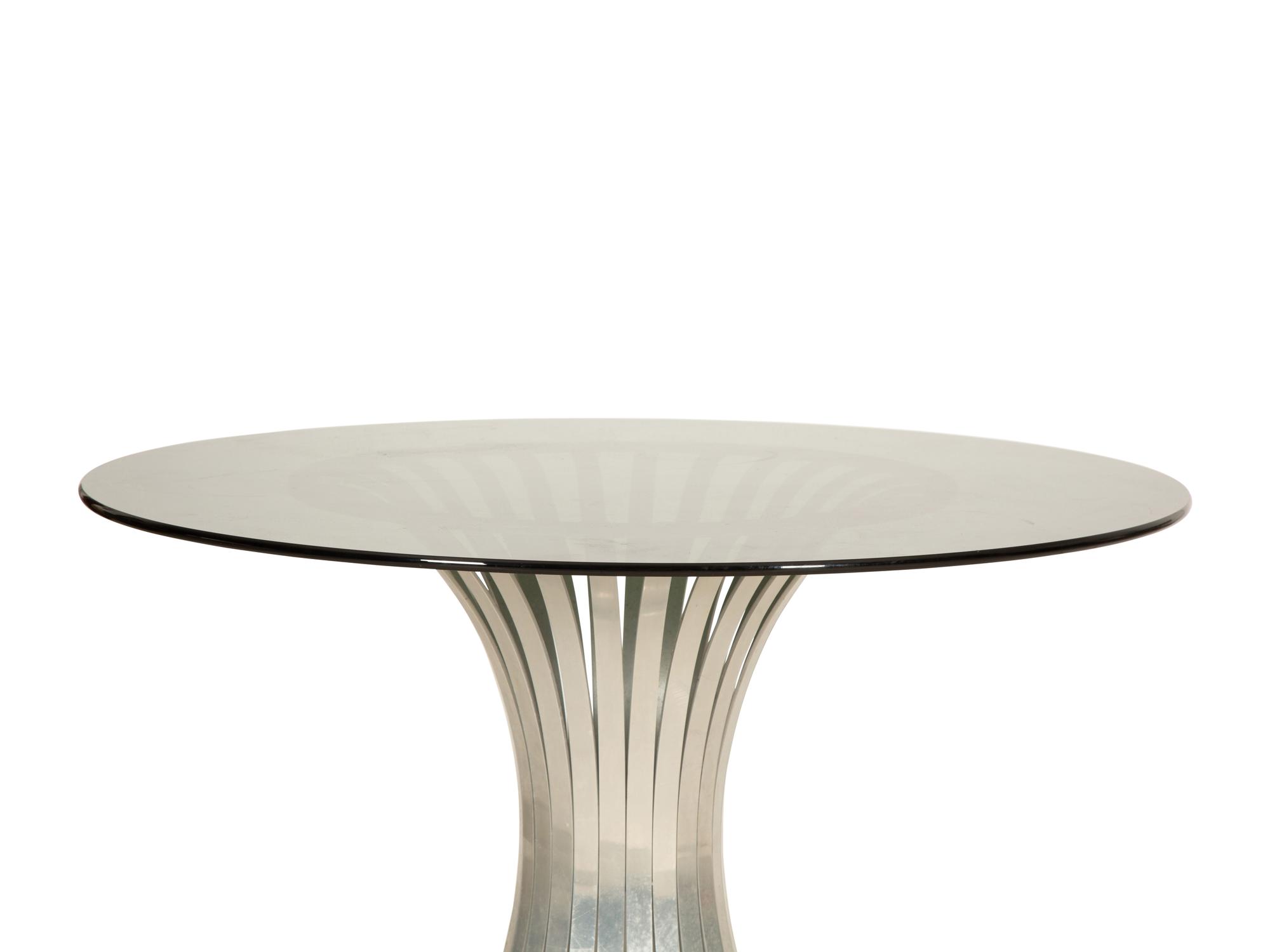 A Russell Woodard Dining Table with Four Chairs