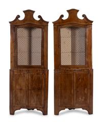 A Pair of Venetian Style Walnut Veneered Corner Cabinets