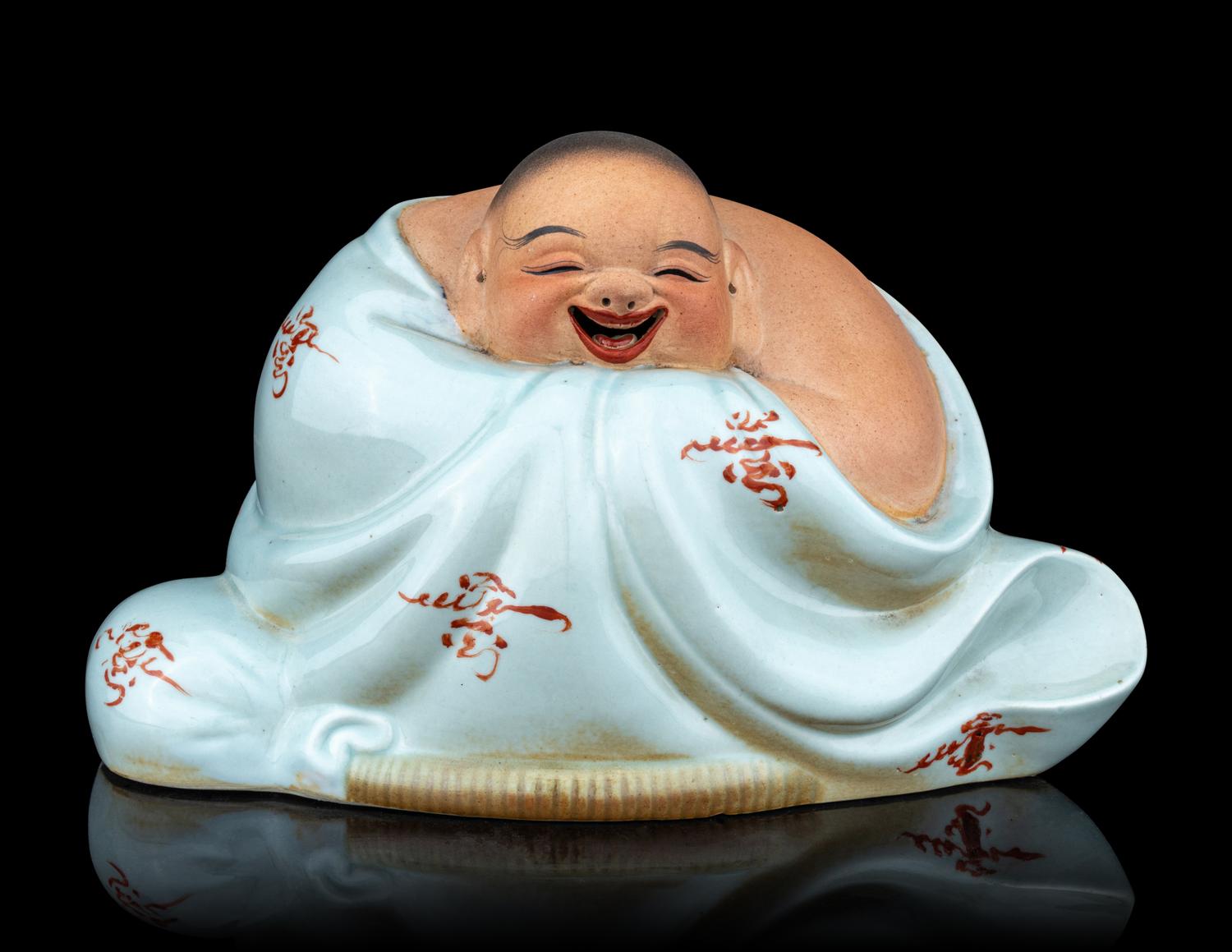 A Celadon Glazed Porcelain Figure of a Budai Buddha