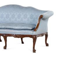 A Pair of George III Carved Oak Sofas