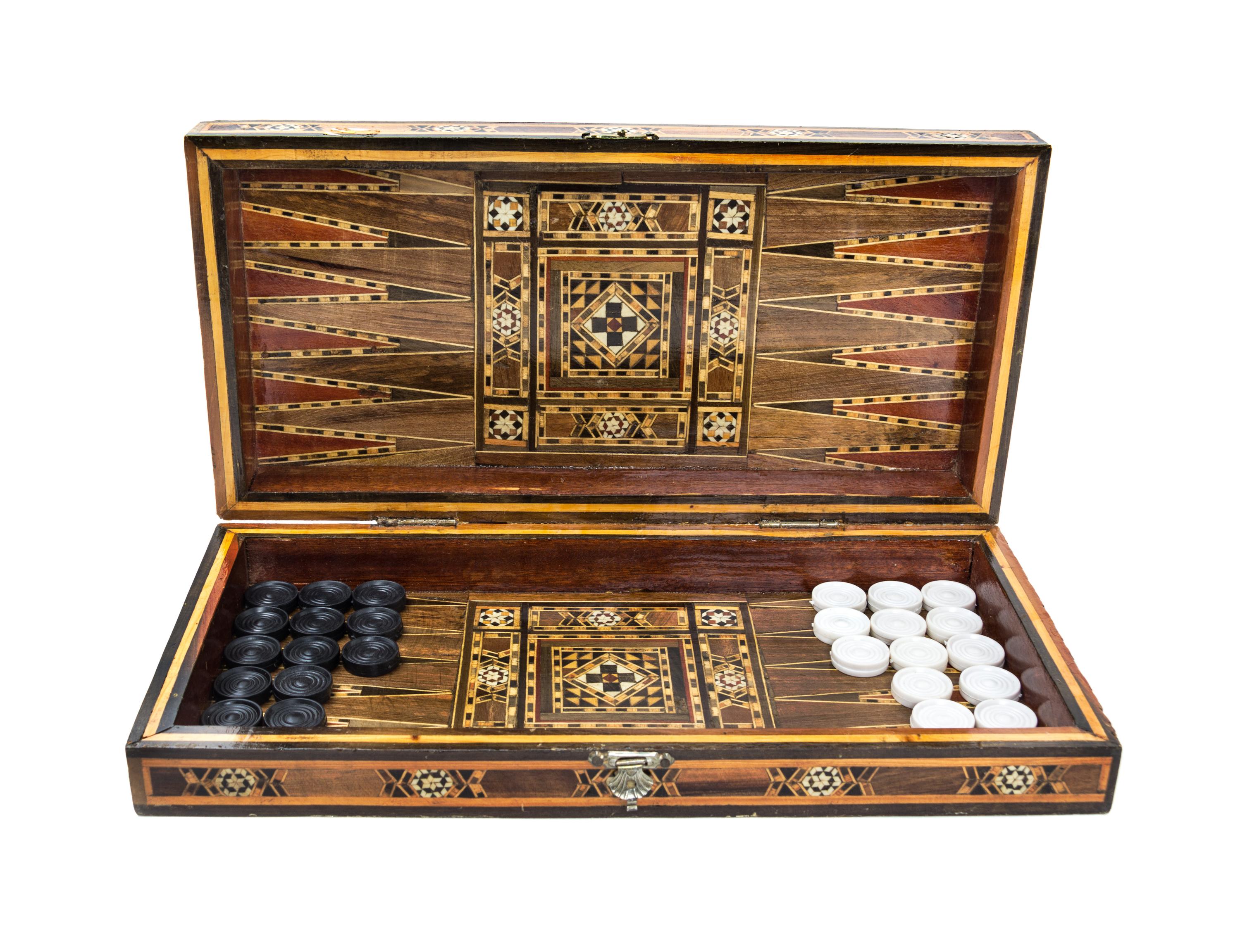 A Syrian Marquetry Inlaid Game Board Height 2 3/4 x width 15 1/4 x depth 7 1/2 inches (closed.)