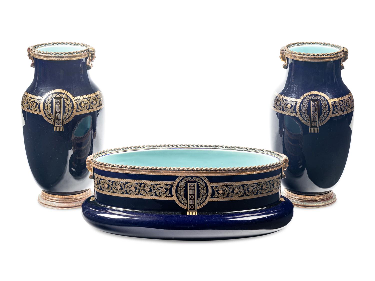 A Sarreguemines Cobalt Glazed Three-Piece Garniture with Egyptian Motif Mounts