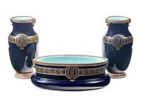 A Sarreguemines Cobalt Glazed Three-Piece Garniture with Egyptian Motif Mounts