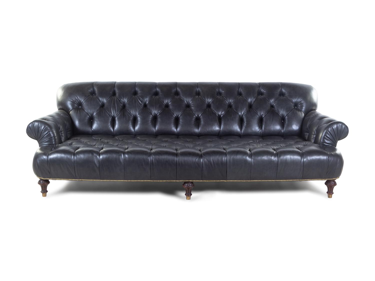 An Oversized Black Leather Upholstered Chesterfield Sofa