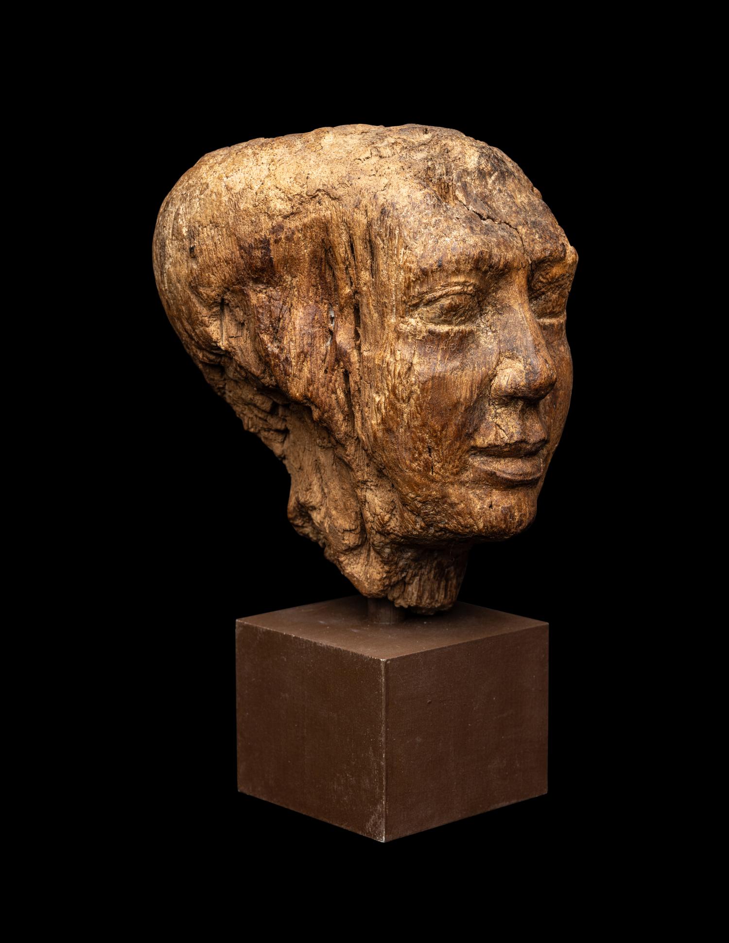 An Egyptian Wood Head of a Priest