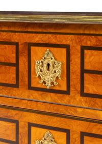 A Régence Style Gilt Metal Mounted Burl Walnut Chest of Drawers