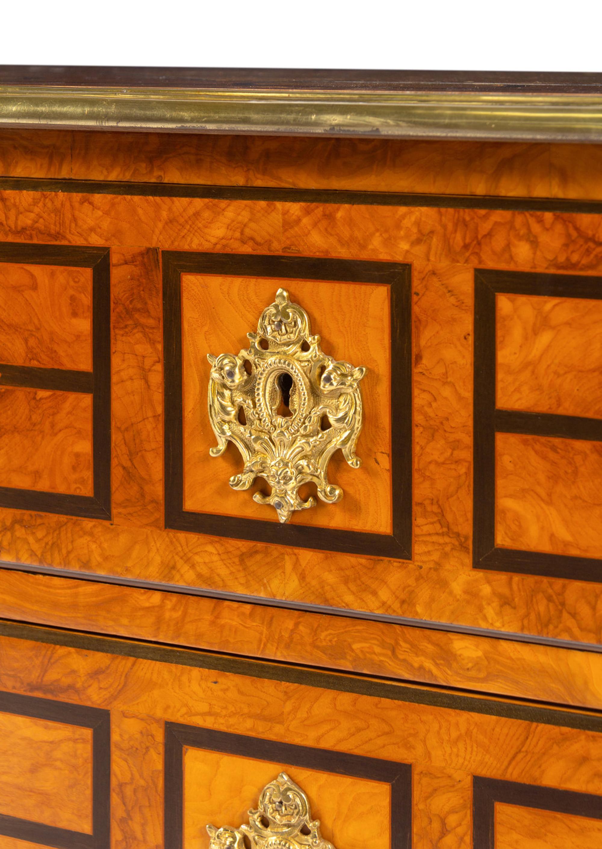 A Régence Style Gilt Metal Mounted Burl Walnut Chest of Drawers