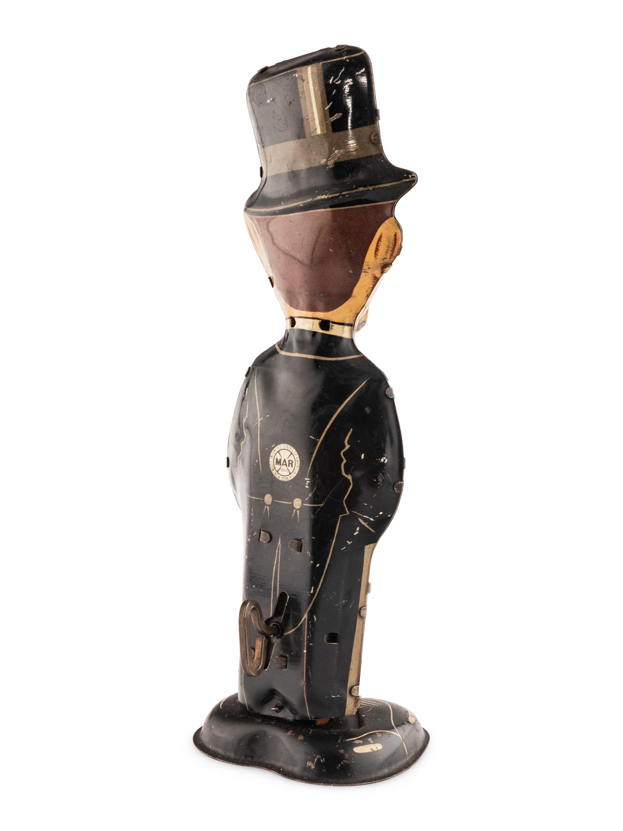 A Group of Three Tin Lithograph Walker Toys