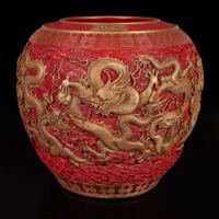 A massive Chinese faux cinnabar lacquer modeled porcelain "Dragons" jardinière 朱紅漆繪模印龍紋缸 Qianlong six character mark in relief to the neck ?????