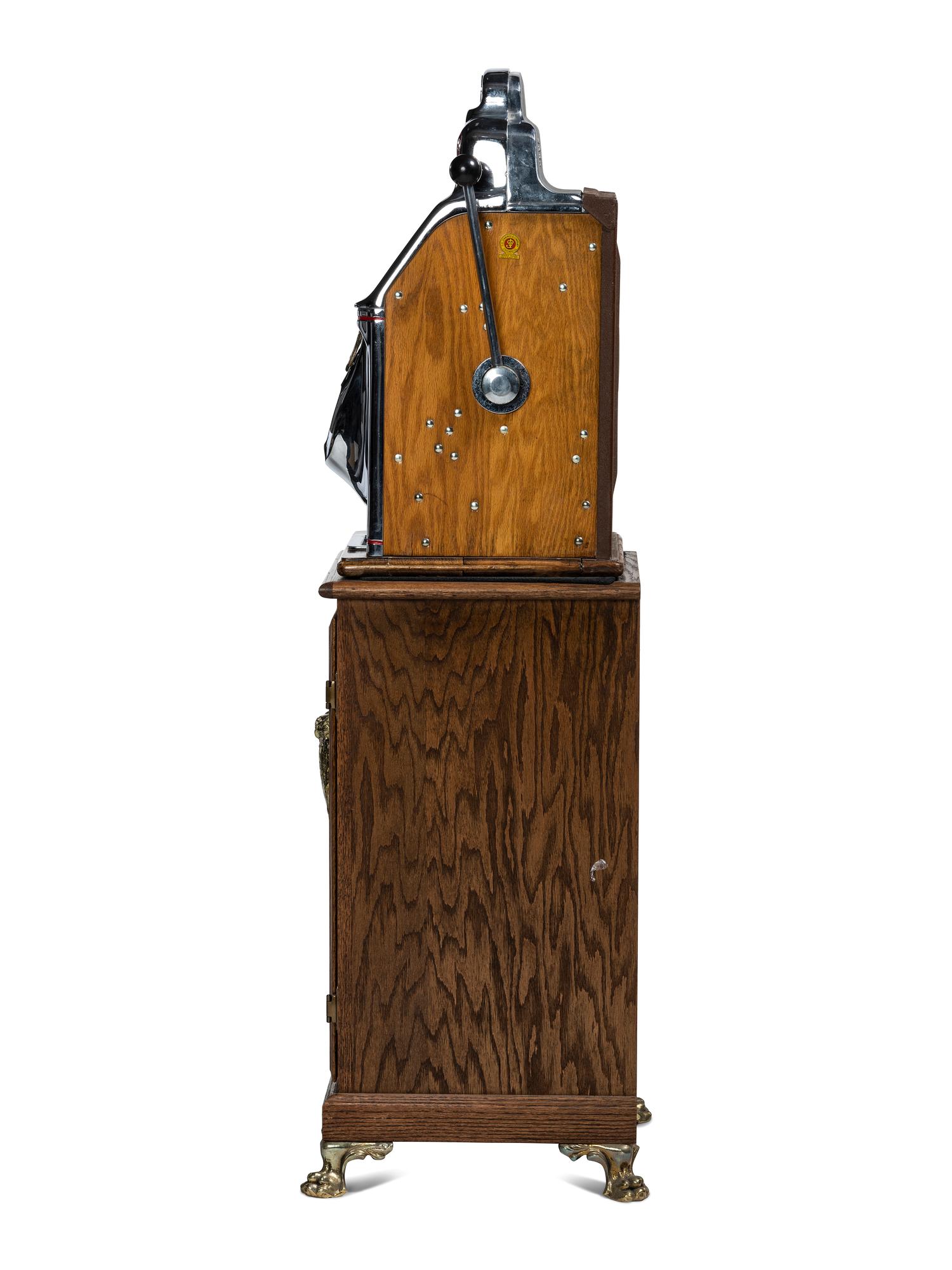 A Silver Dollar Standard Chief Slot Machine on Stand